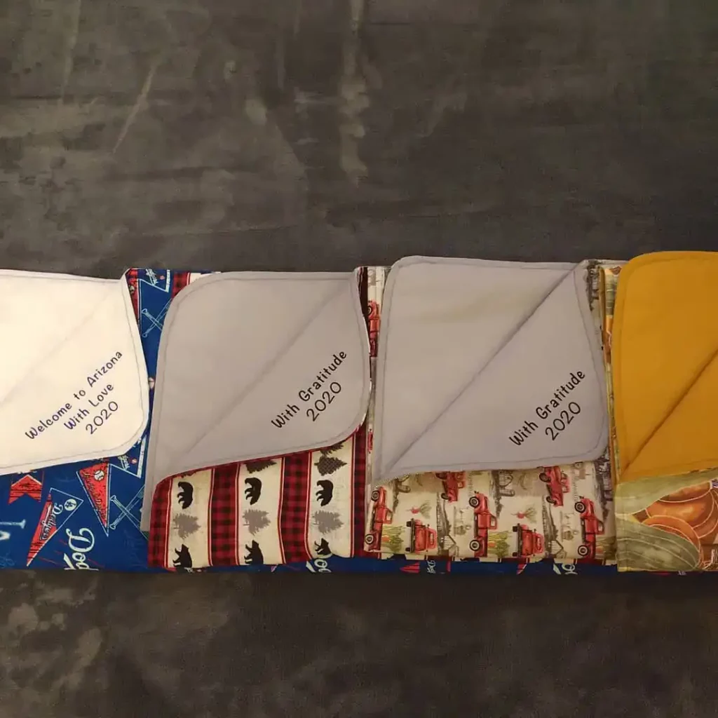 Blankets with welcome greeting ironed on