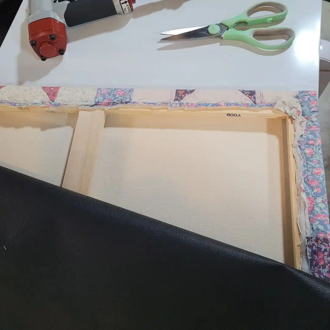back side of wooden framing that quilt is attached too